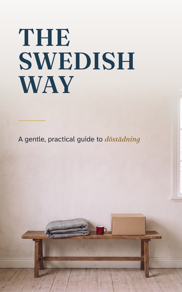 Front cover of The Swedish Way guide: a bench with a folded blanket and a red mug in a pale Swedish hallway
